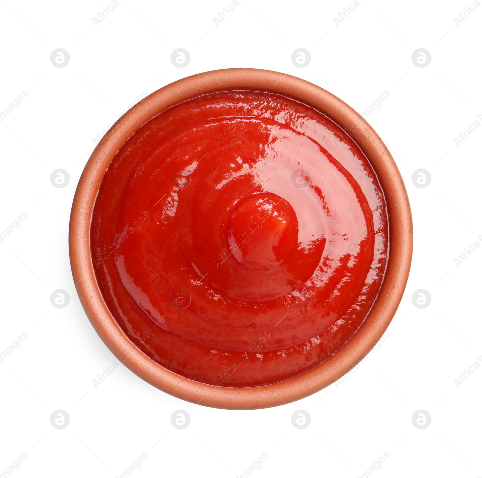 Photo of Tasty ketchup in bowl isolated on white, top view. Tomato sauce