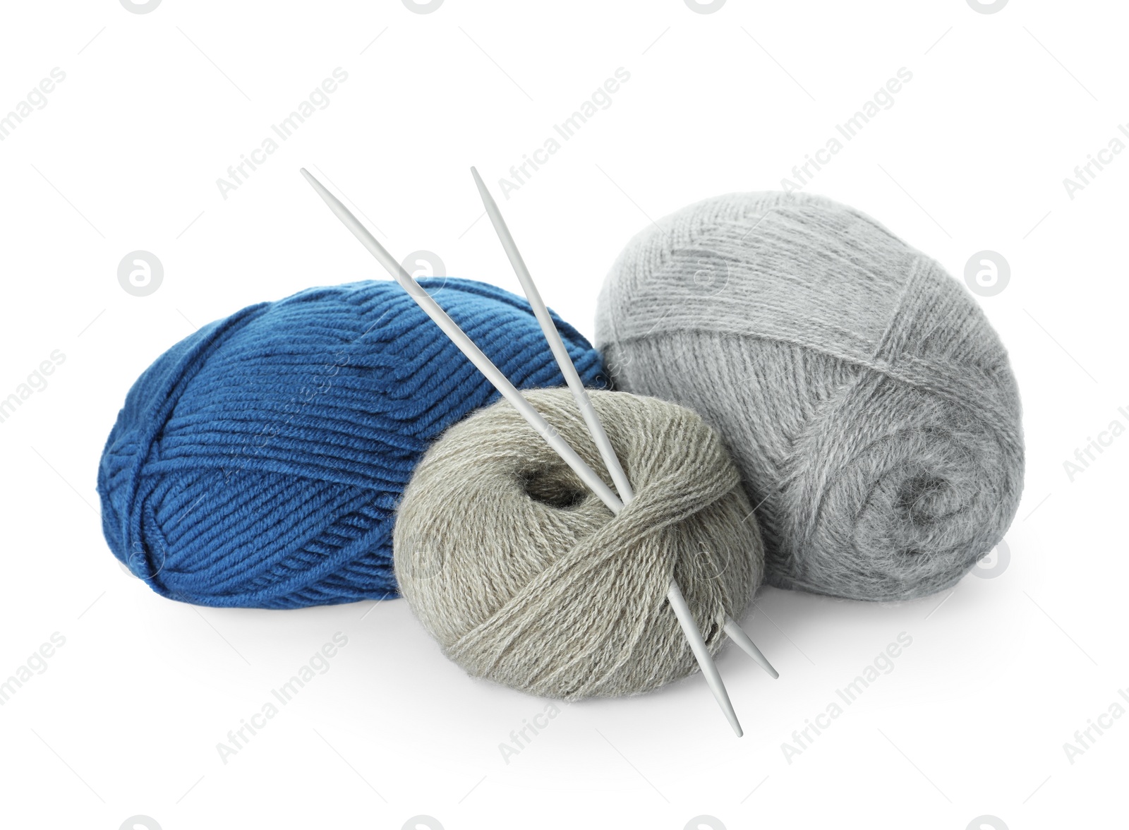 Photo of Different balls of woolen knitting yarns and needles on white background