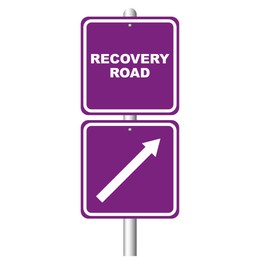 Purple signpost with phrase Recovery Road and arrow on white background