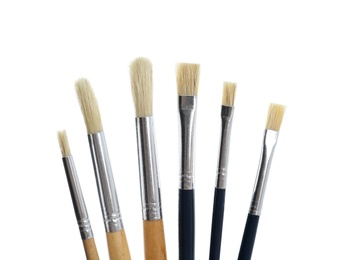 Photo of Set of different paint brushes on white background