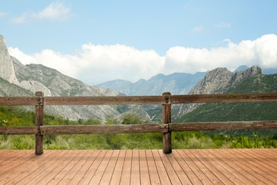 Outdoor wooden terrace revealing picturesque view on mountains