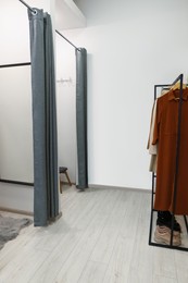 Photo of Dressing rooms in fashion store. Interior design