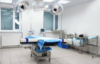 Photo of Surgery room interior with modern equipment in clinic