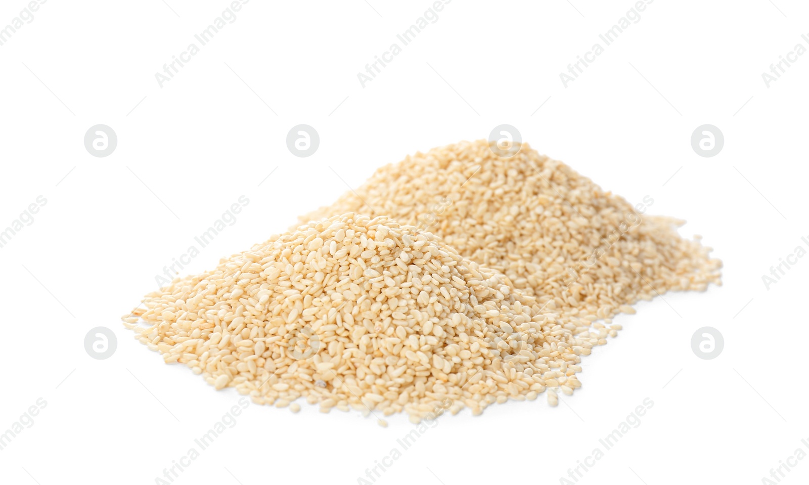 Photo of Piles of sesame seeds on white background