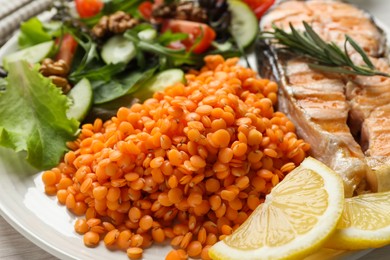 Plate with healthy food high in vegetable fats on table, closeup