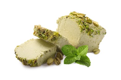 Image of Tasty halva with pistachios and mint leaves isolated on white