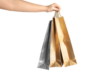 Photo of Woman holding paper shopping bags on white background, closeup