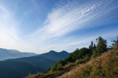 Photo of Picturesque view of blue sky with clouds over mountain landscape