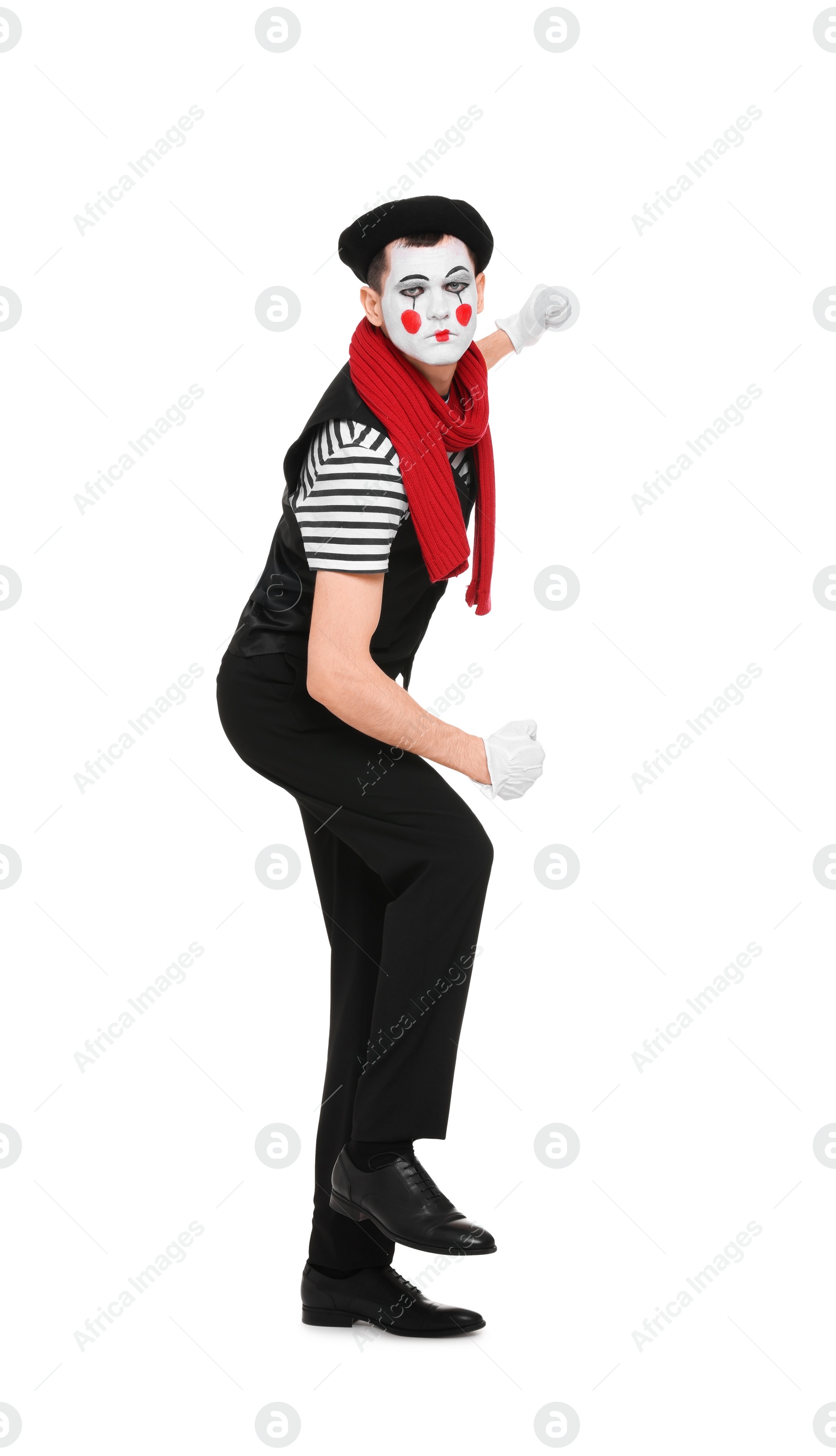 Photo of Funny mime artist in beret posing on white background