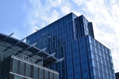 Exterior of beautiful modern skyscrapers against blue sky