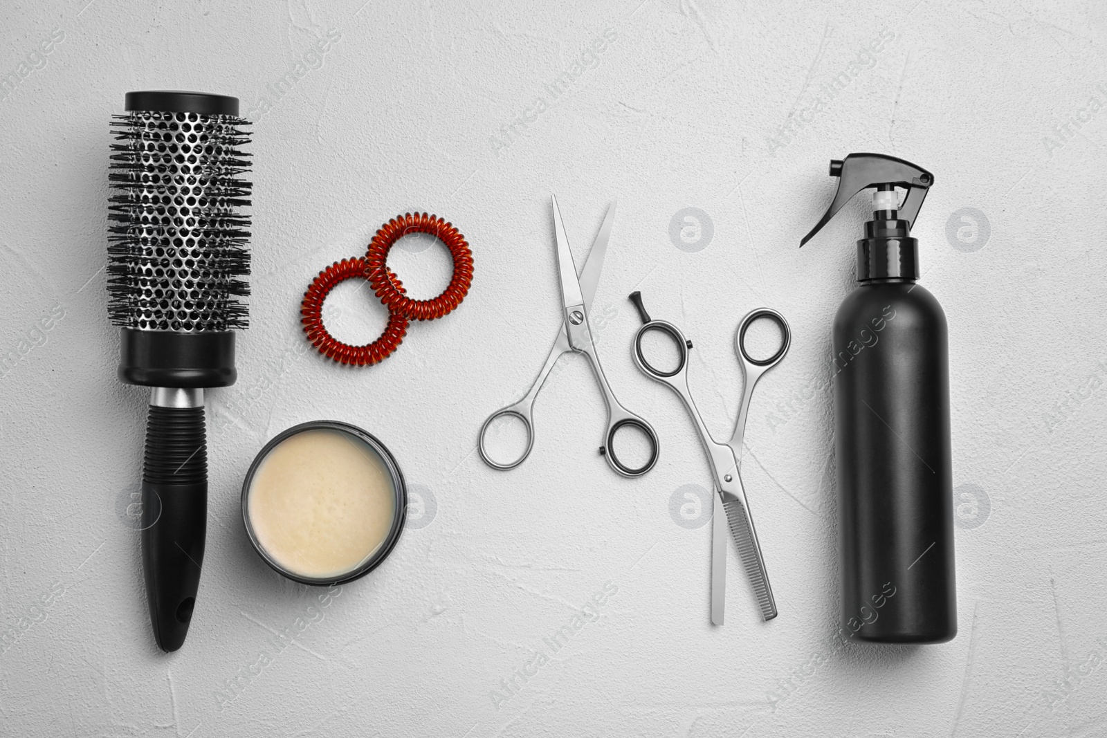 Photo of Professional hairdresser set on light background