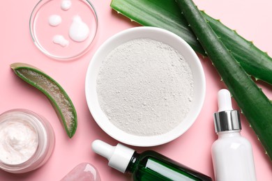 Photo of Flat lay composition with cosmetic products and cut aloe leaves on pink background