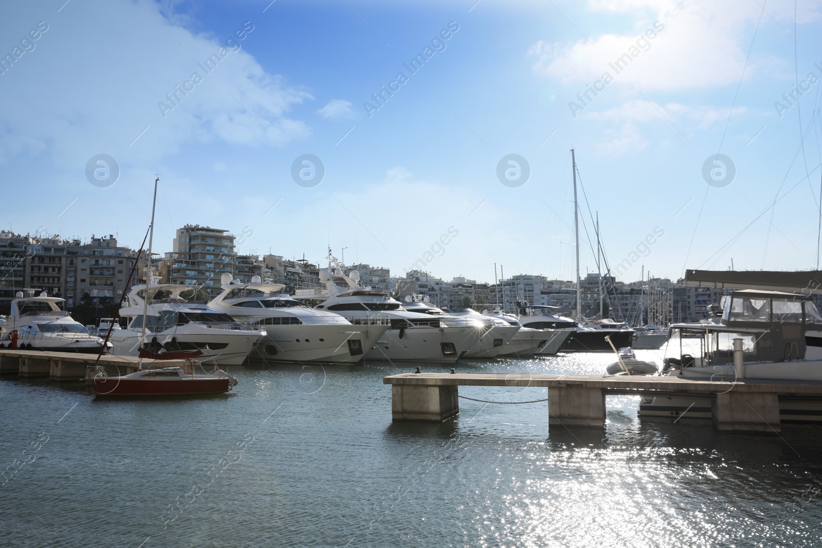 Photo of Picturesque view of port with modern boats on sunny day