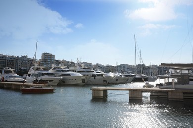 Photo of Picturesque view of port with modern boats on sunny day