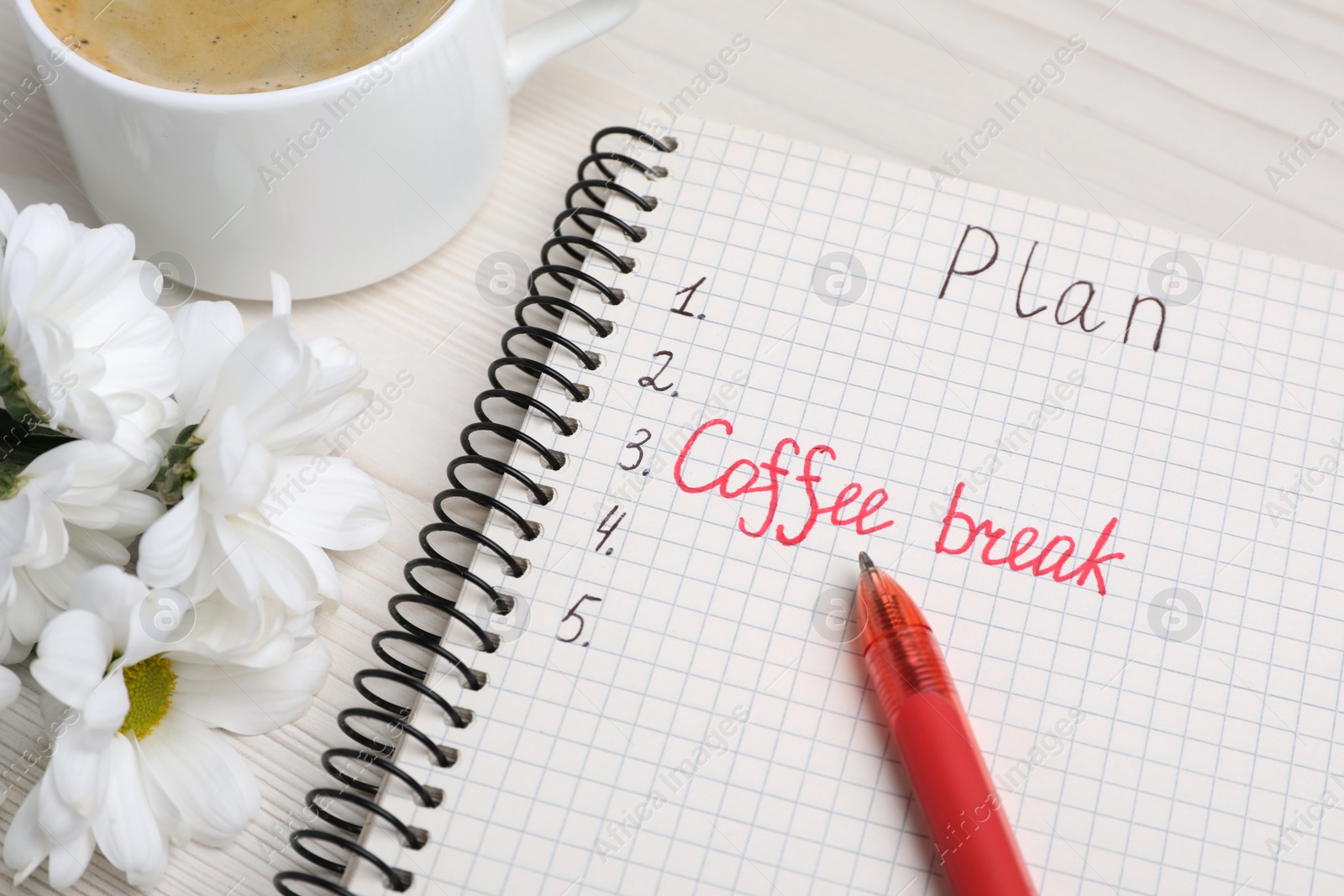 Photo of Notebook with phrase Coffee Break among plan items, cup of drink and flowers on white wooden table, closeup