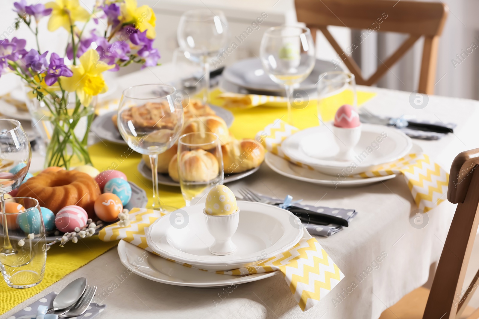 Photo of Festive Easter table setting with traditional meal at home