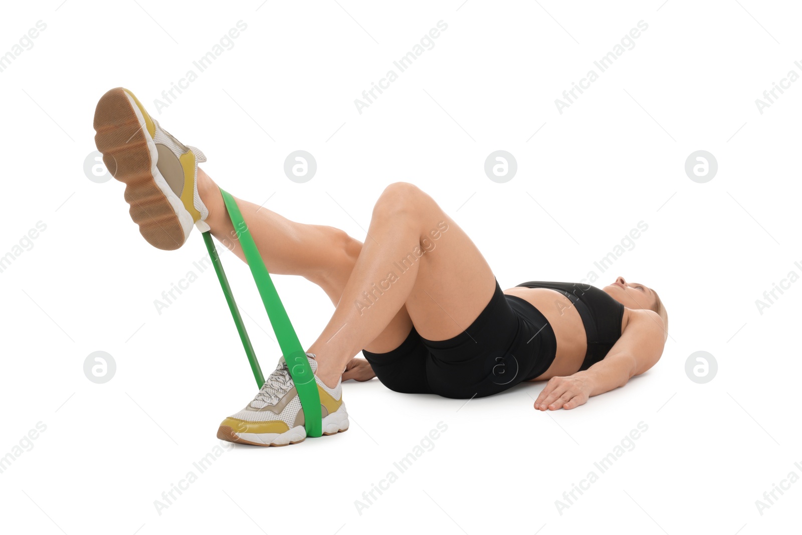 Photo of Woman exercising with elastic resistance band on white background, selective focus