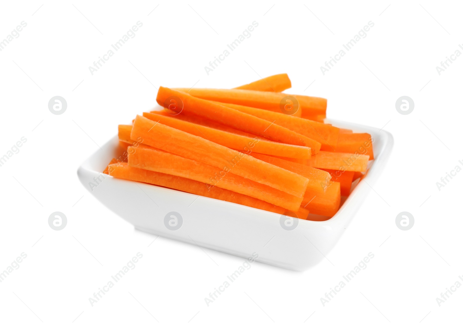 Photo of Bowl of chopped raw carrot isolated on white