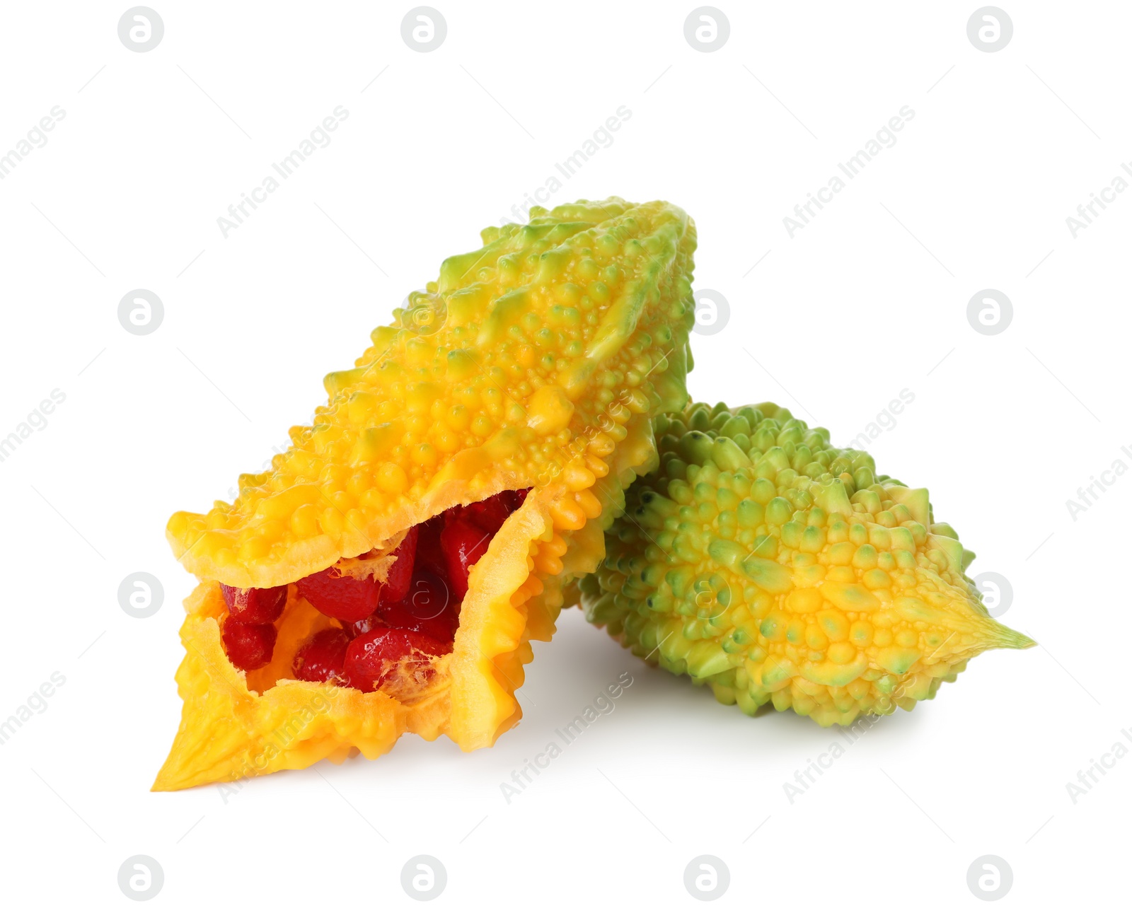 Photo of Fresh ripe bitter melons on white background