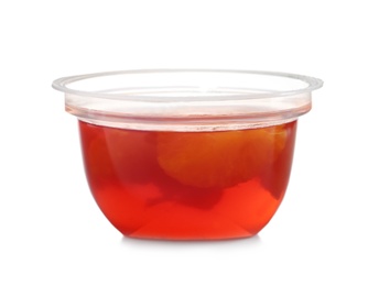 Photo of Tasty jelly dessert with slices of fruit in plastic cup on white background