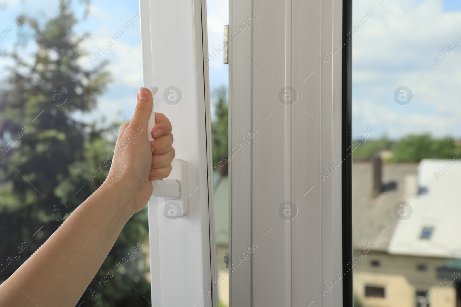 Photo of Woman opening white plastic window indoors, closeup. Space for text