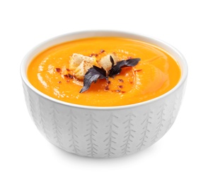 Image of Tasty creamy pumpkin soup in bowl on white background
