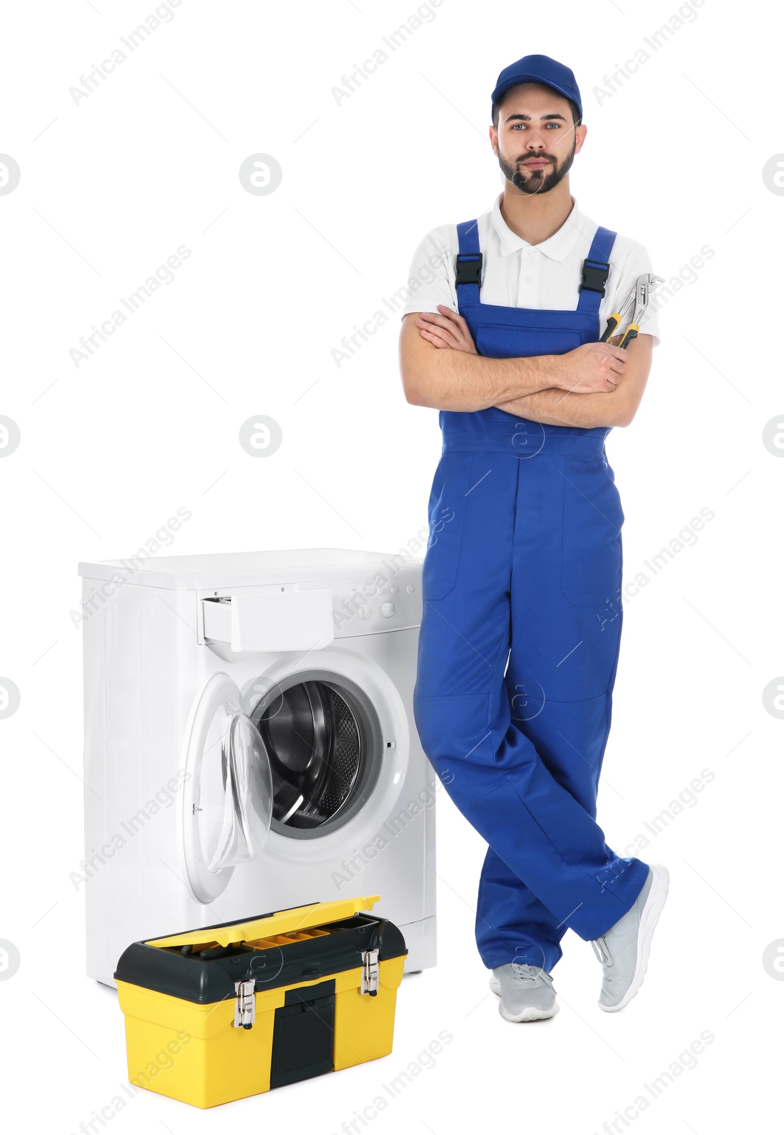 Photo of Repairman with toolbox near washing machine on white background