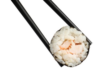 Photo of Chopsticks with tasty fresh sushi roll isolated on white