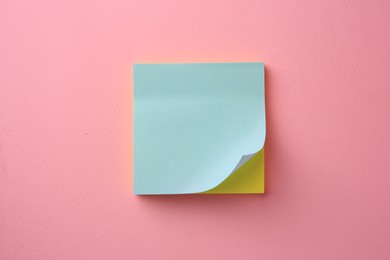 Blank paper notes on pink background, top view