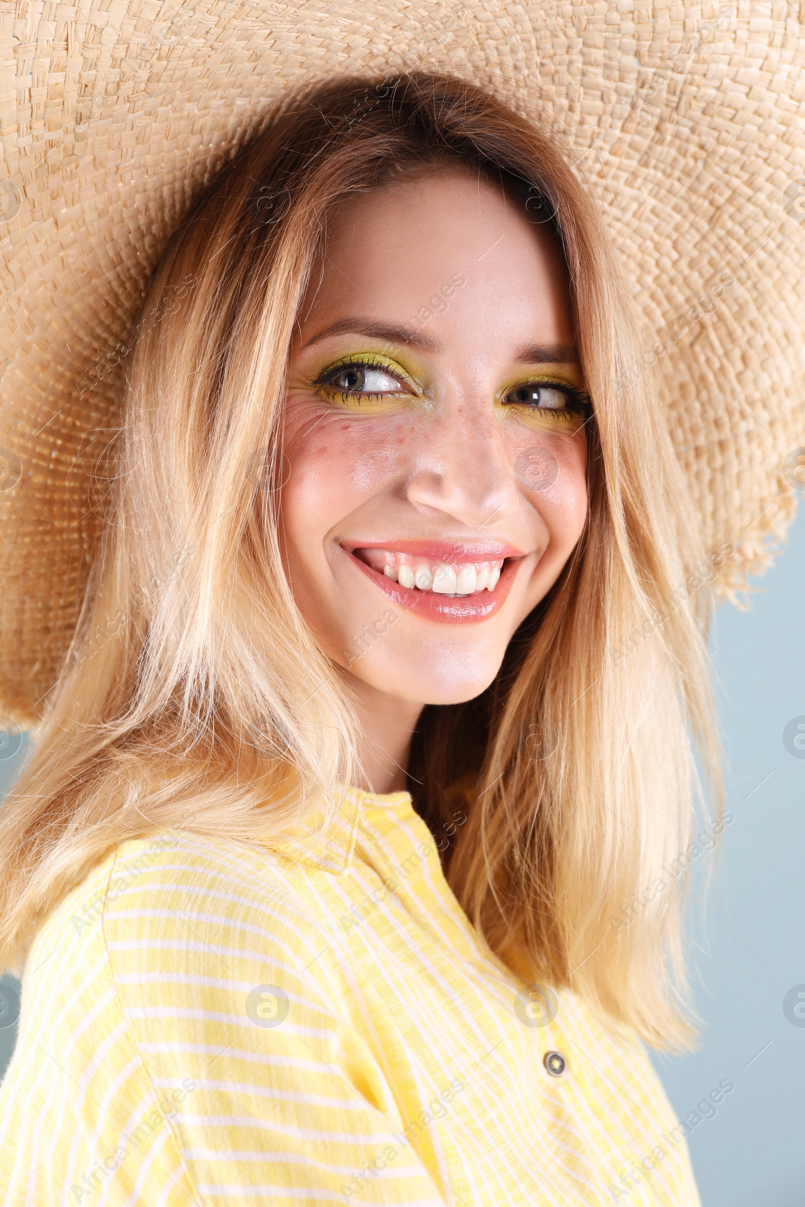 Photo of Beautiful young woman in hat, closeup. Summer fashion