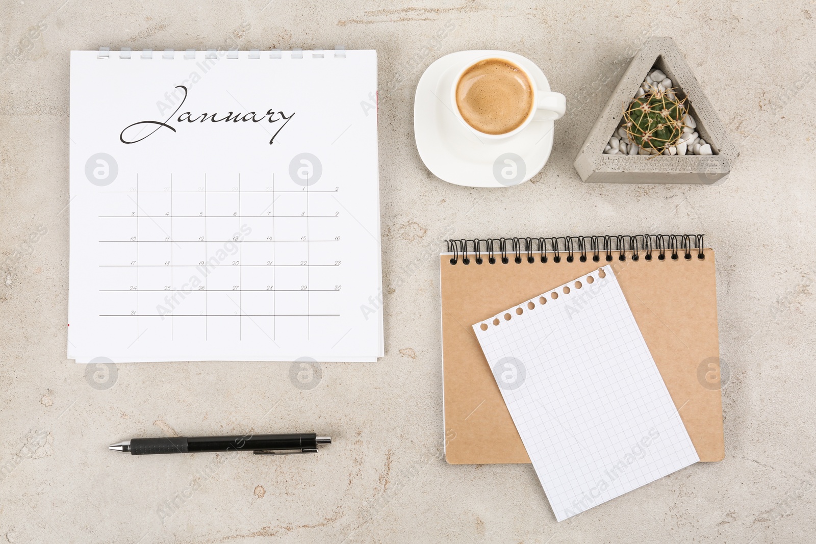 Photo of Flat lay composition with calendar on light grey stone background