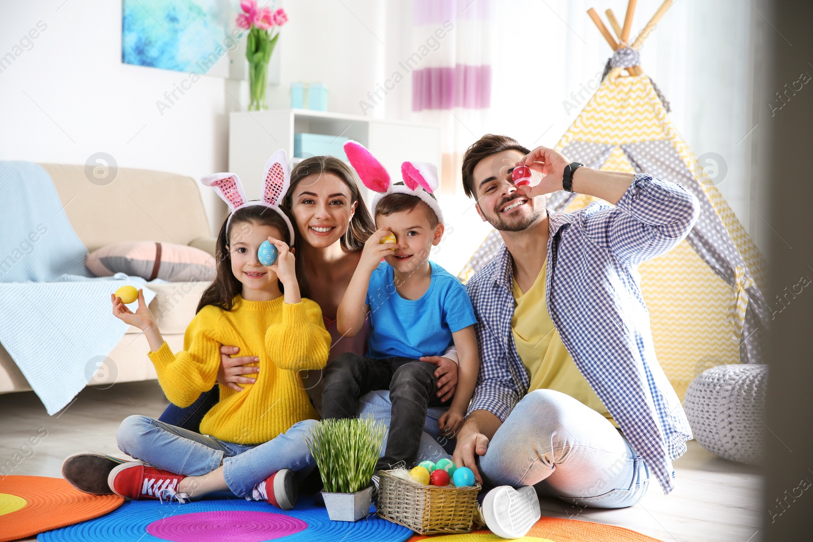 Photo of Happy family spending time together during Easter holiday at home