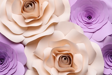 Different beautiful flowers made of paper as background, top view