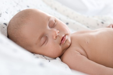 Cute little baby sleeping on bed, closeup