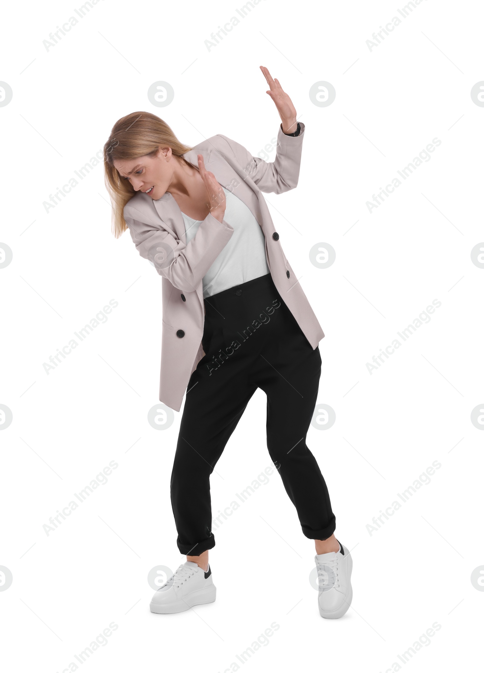 Photo of Beautiful businesswoman avoiding something on white background