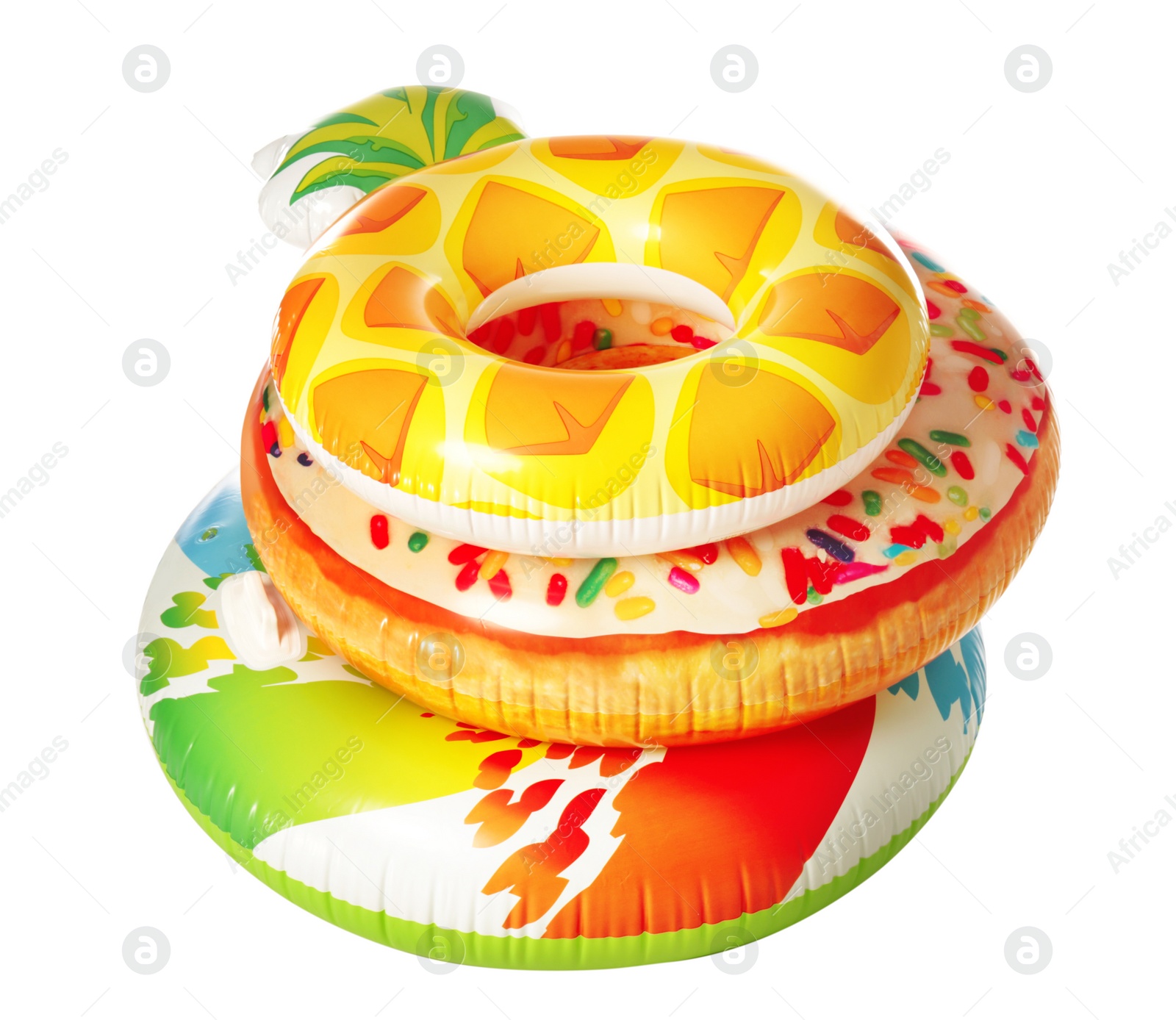 Photo of Different bright inflatable rings on white background. Summer holidays