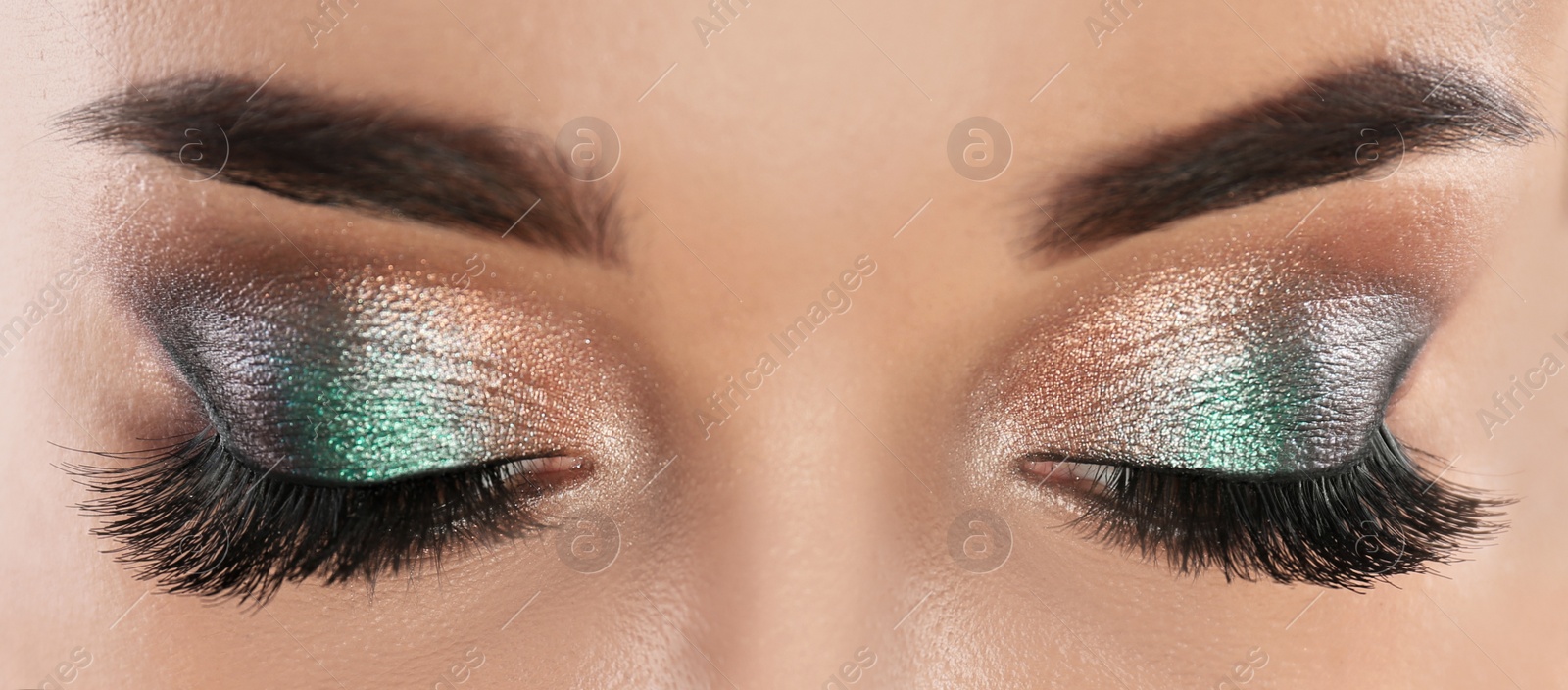 Image of Young woman with beautiful long eyelashes, closeup view. Banner design