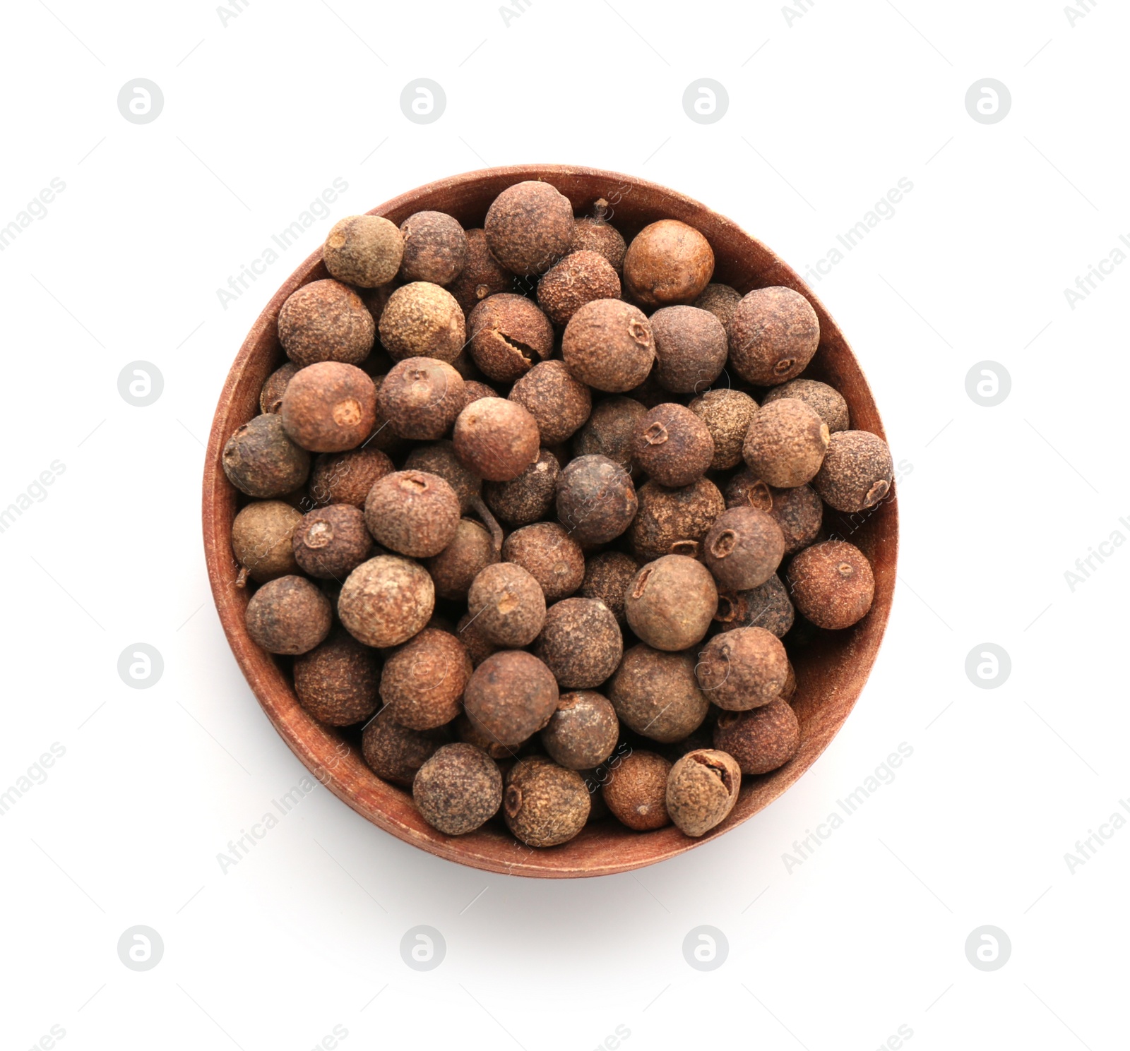 Photo of Wooden bowl with allspice pepper grains on white background, top view