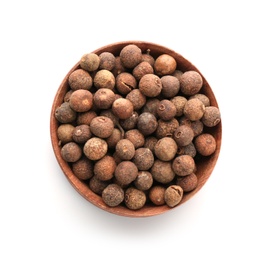 Wooden bowl with allspice pepper grains on white background, top view