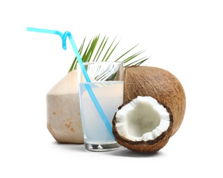 Photo of Glass of coconut milk and nuts on white background