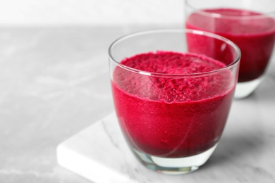 Photo of Glass of fresh beet juice, closeup