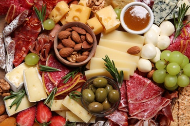 Photo of Tasty assorted appetizers as background, top view
