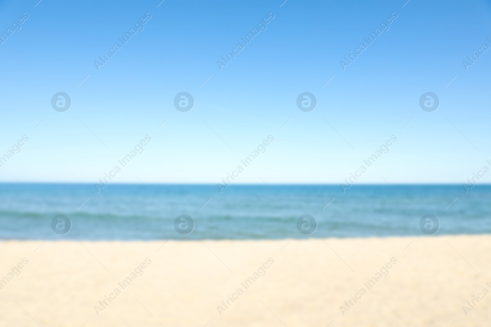 Photo of Blurred view of sandy beach near sea