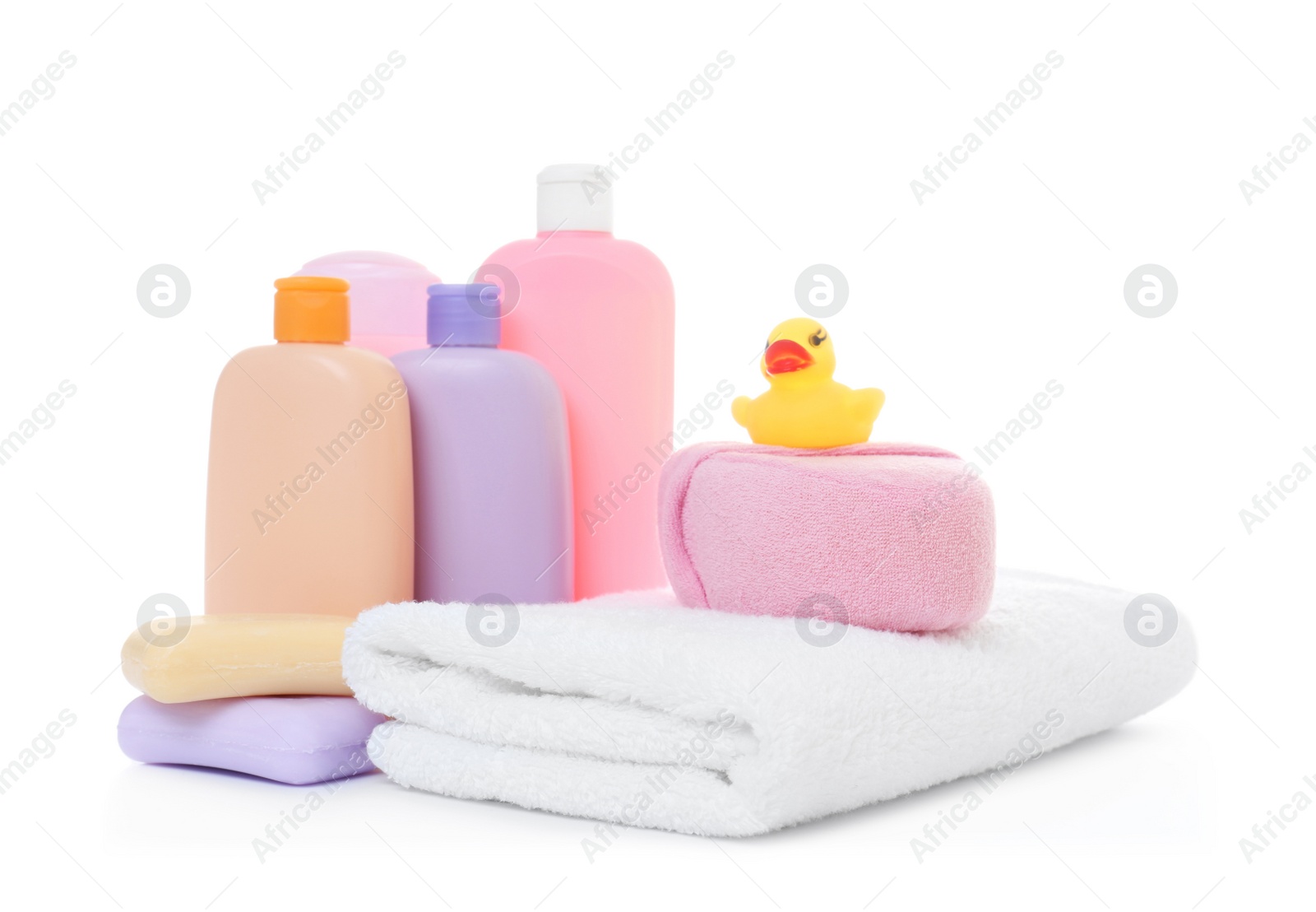 Photo of Baby cosmetic products, toy and towel isolated on white