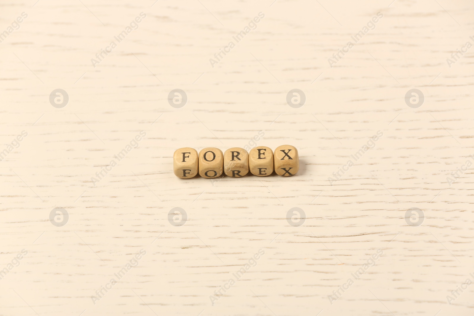 Photo of Word Forex with cubes on white wooden table