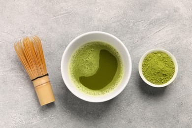Photo of Flat lay composition with matcha tea on light gray textured table