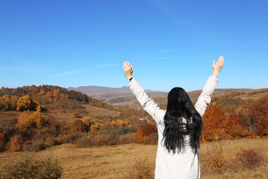 Female traveler feeling free in peaceful mountains