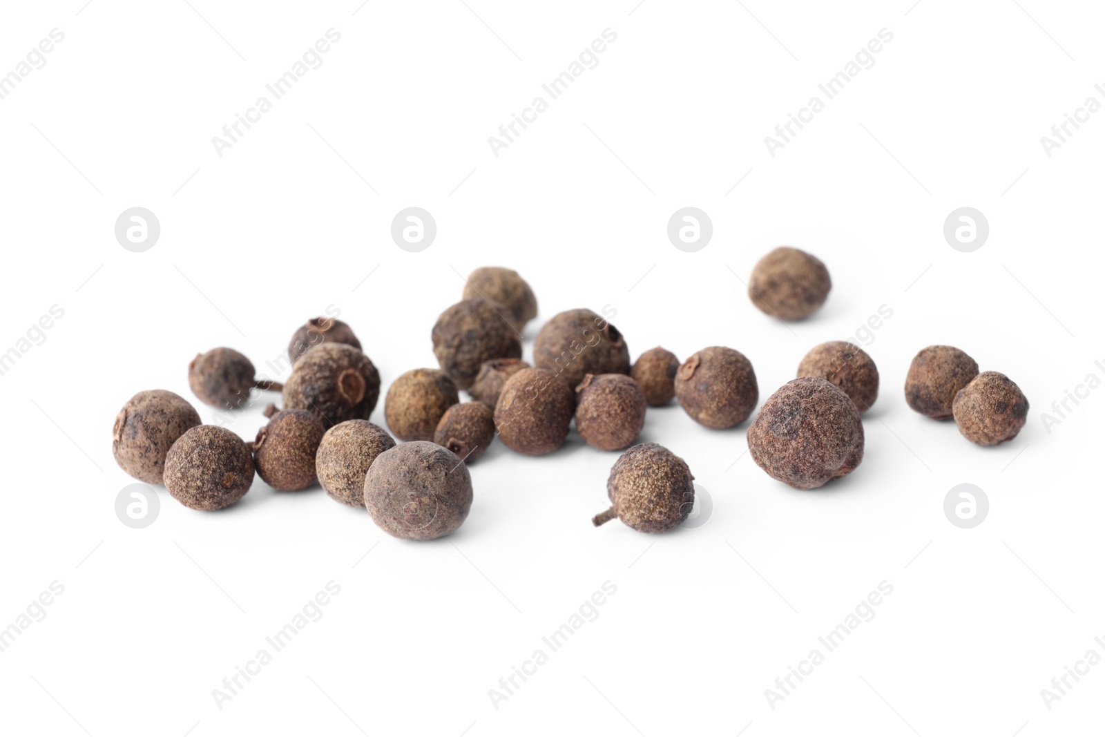 Photo of Spicy black pepper grains isolated on white