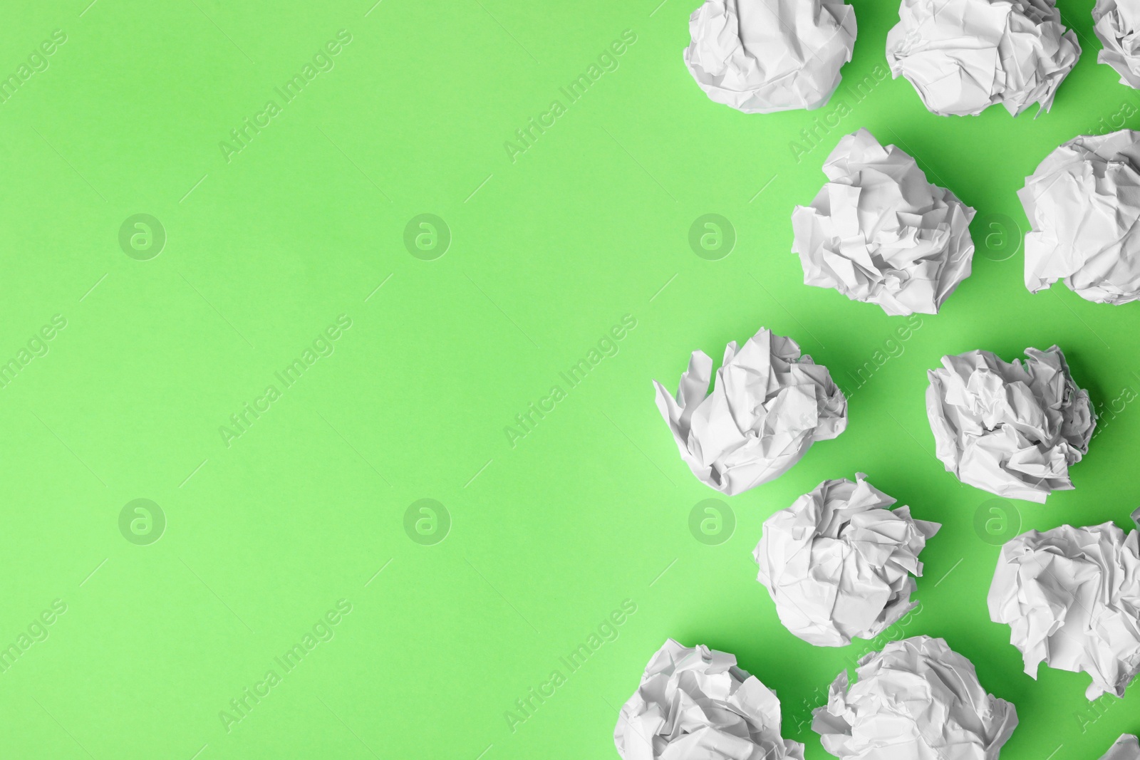 Photo of Paper balls on color background, flat lay. Space for text