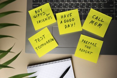 Photo of Many different reminder notes and laptop on white table, flat lay